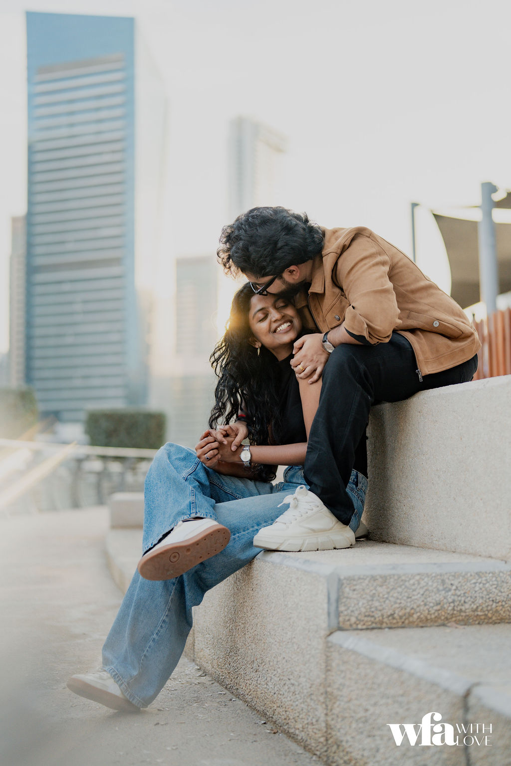 Couple sitting together on steps