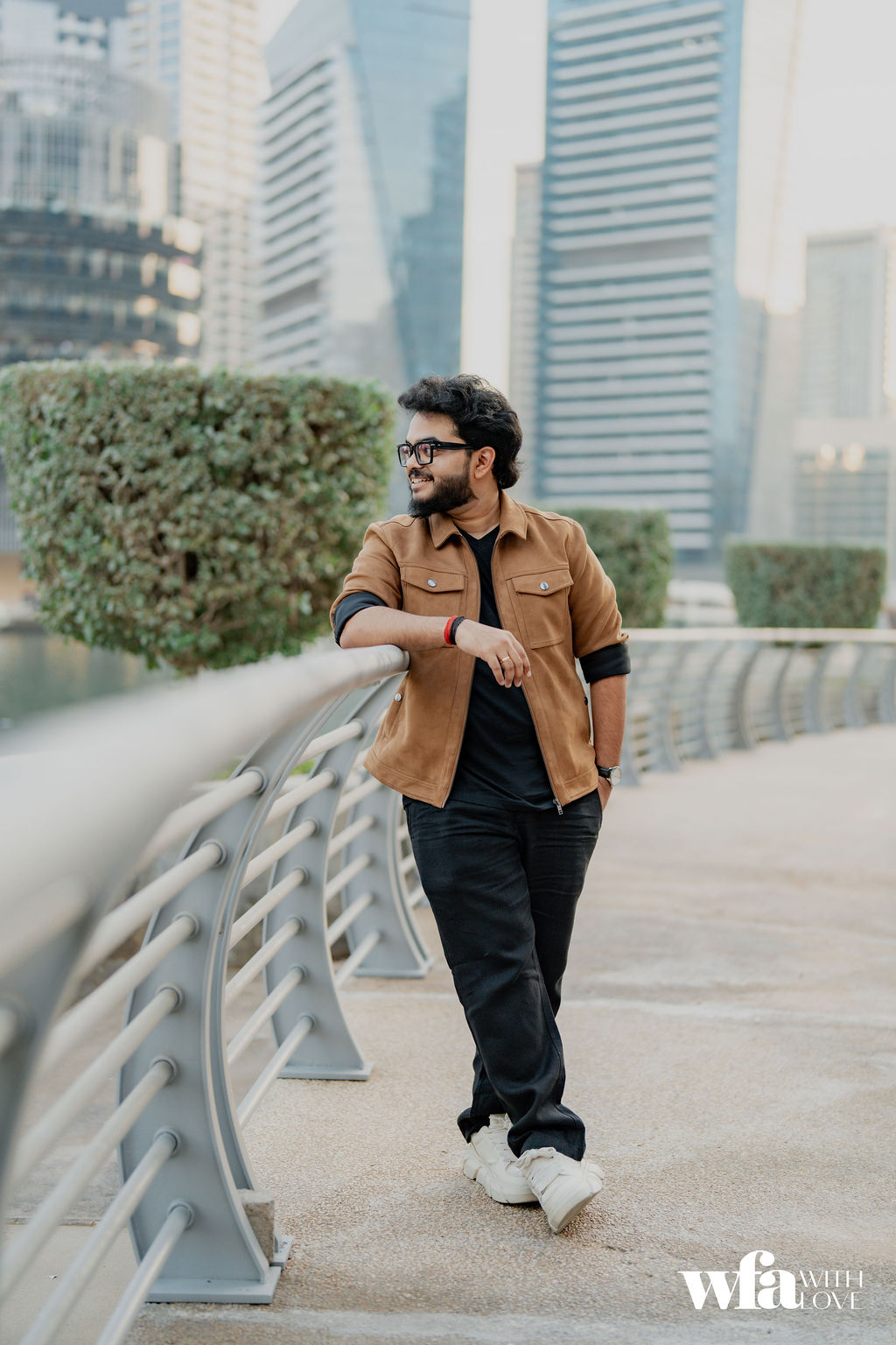 Groom leaning on the railing