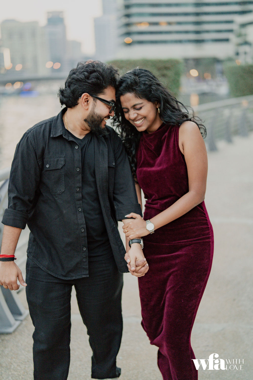 Couple walking along the waterfront